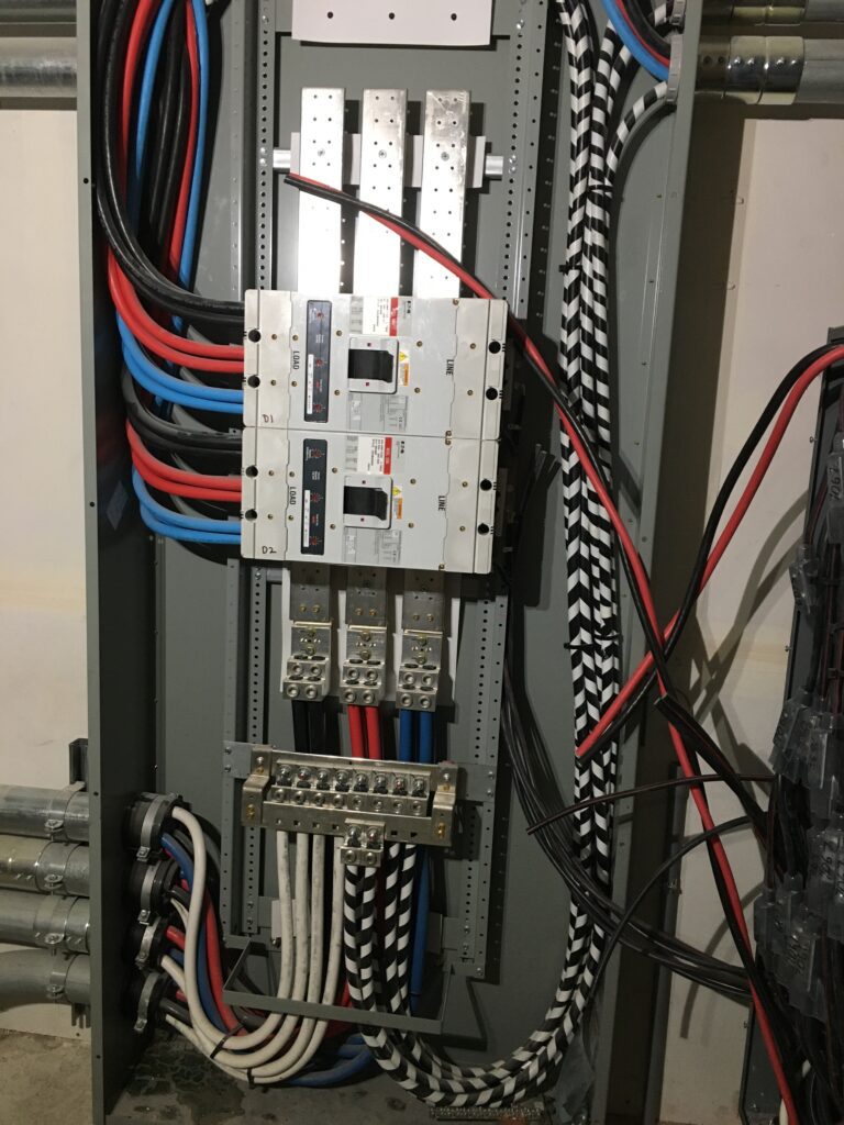 A bunch of wires that are connected to an electrical panel.